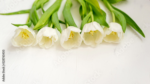Fototapeta Naklejka Na Ścianę i Meble -  Flowers composition. Delicate tulip flowers on white backdrop. Valentines day, Mothers day concept. Top view, copy space