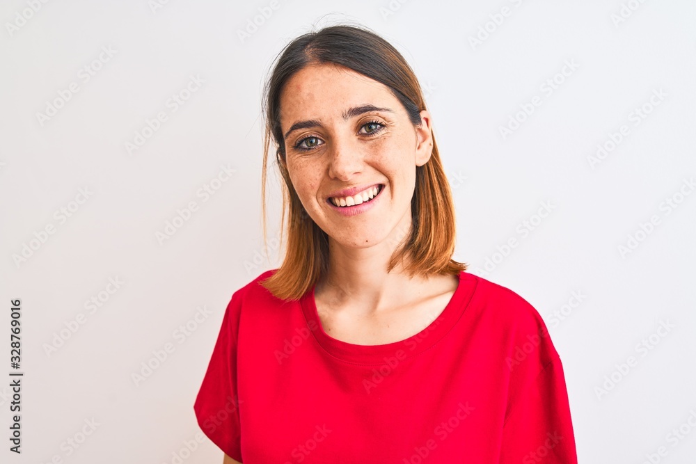 Beautiful redhead woman wearing casual red t-shirt over isolated background with a happy and cool smile on face. Lucky person. Beautiful redhead woman wearing casual red t-shirt over isolated background with a happy and cool smile on face. Lucky person.