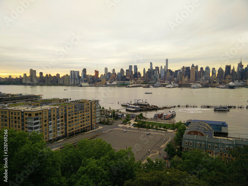 View of evening New York across the river. Manhattan at sunset. City center from a bird s eye view. Photo from the quadrocopter.