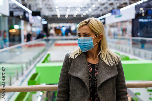 Pretty women wearing mask protection dust in shopping mall, selective focus.