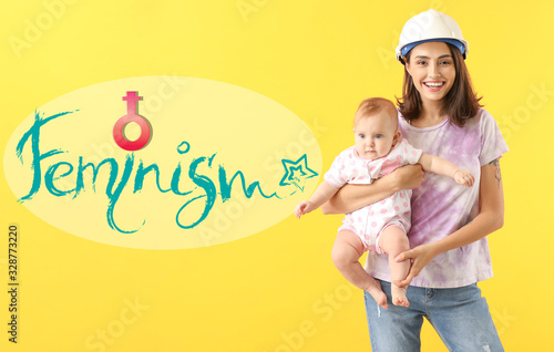 Young woman with baby on color background. Concept of feminism © Pixel-Shot
