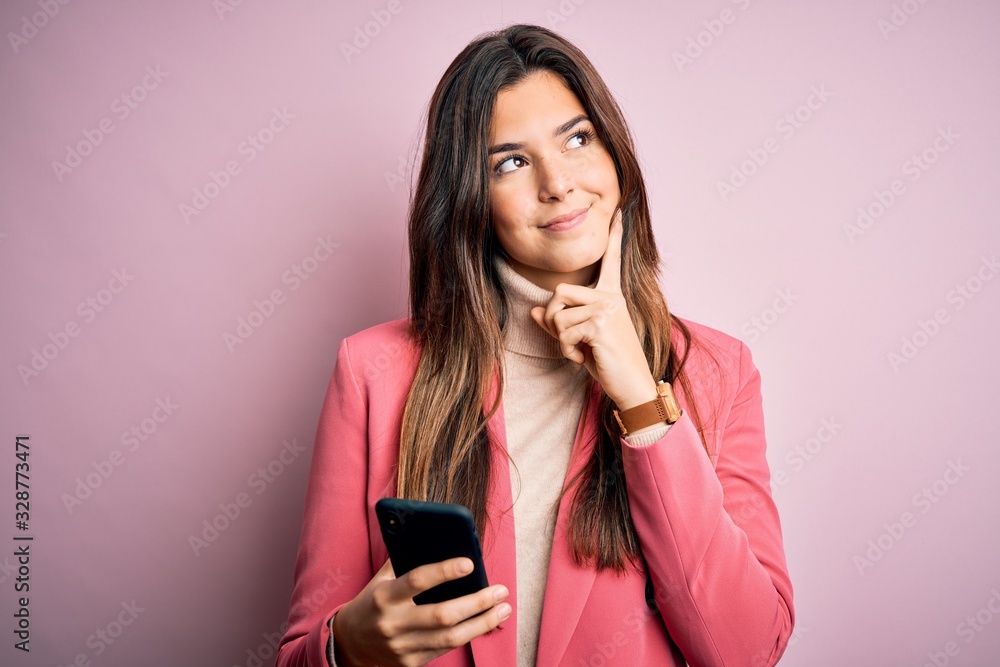 Young beautiful girl having conversation using smartphone over white background serious face thinking about question, very confused idea Young beautiful girl having conversation using smartphone over white background serious face thinking about question, very confused idea