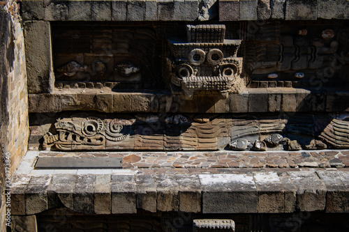 Mexican ancient historic sculptures in Quetzalcoatl temple at Teotihuacan, Mexico