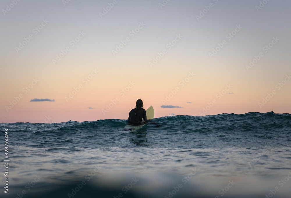 Surfer at sunset, Bronte Beach Australia