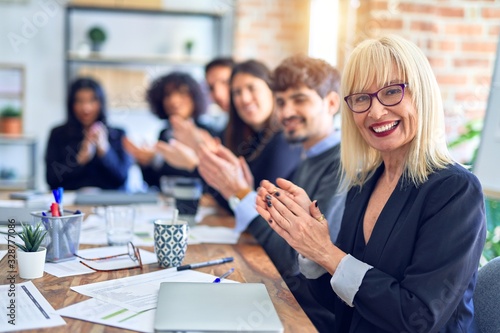 Wallpaper Mural Group of business workers smiling happy and confident. Working together with smile on face looking at the camera applauding at the office Torontodigital.ca