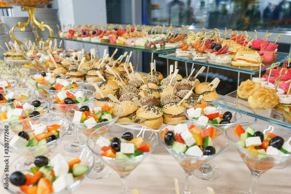 Catering and guest meals during the event. Quick mini snacks in a special beautiful dish. Canapes and light meals, tapas on the table in the restaurant.