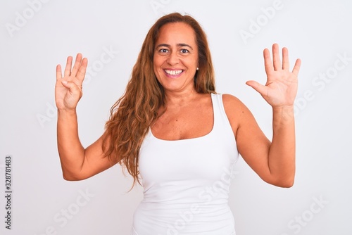Wallpaper Mural Middle age mature woman standing over white isolated background showing and pointing up with fingers number nine while smiling confident and happy. Torontodigital.ca