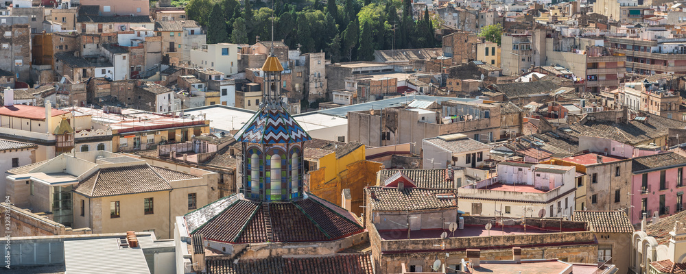 Fototapeta premium Tiled roof of a church building, Tortosa, Catalonia, Tarragona, Spain.