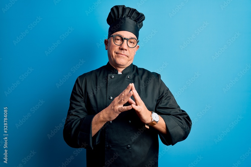 Middle age handsome grey-haired chef man wearing cooker uniform and hat Hands together and fingers crossed smiling relaxed and cheerful. Success and optimistic Middle age handsome grey-haired chef man wearing cooker uniform and hat Hands together and fingers crossed smiling relaxed and cheerful. Success and optimistic