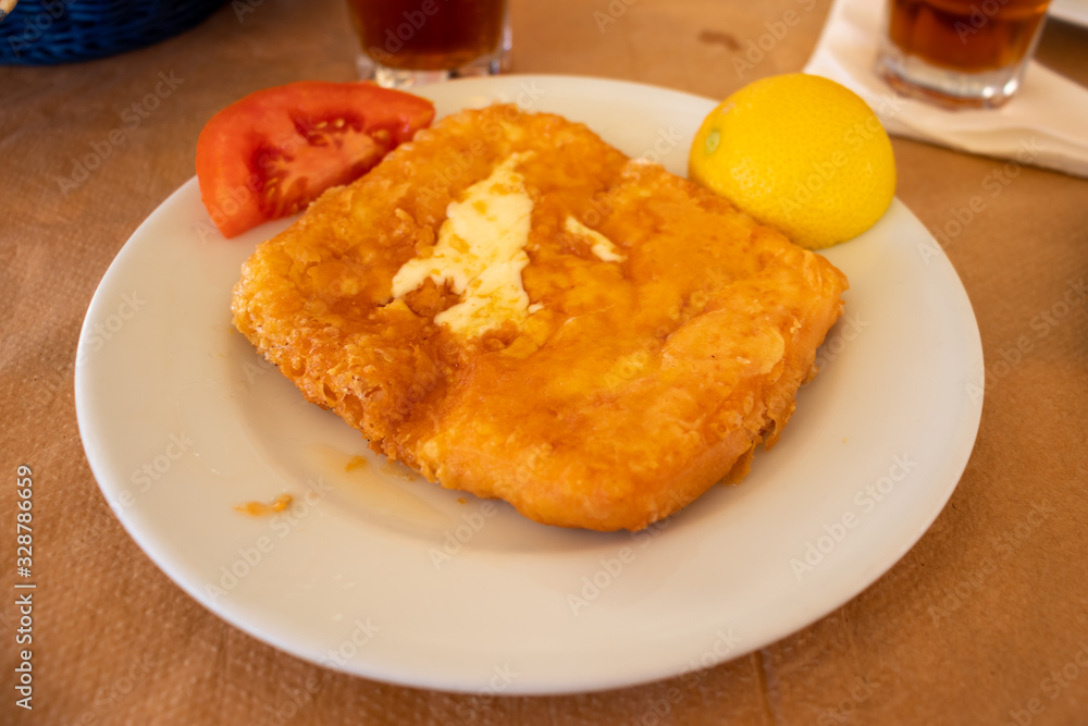 greek cuisine fried hard cheese served on a plate greek cuisine fried hard cheese served on a plate