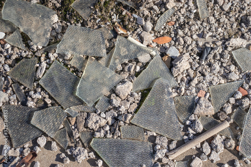 Wallpaper Mural Trash on the ground: dry grass, small stones, broken glass Torontodigital.ca