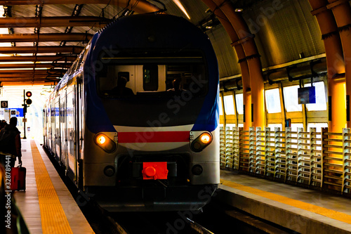 Rome, Italy. Train station, public transportation travel restrictions, few people traveling. City state lock down, ghost town. Covid19/ covid-19/ Coronavirus/ Corona Virus outbreak epidemic pandemic. photo