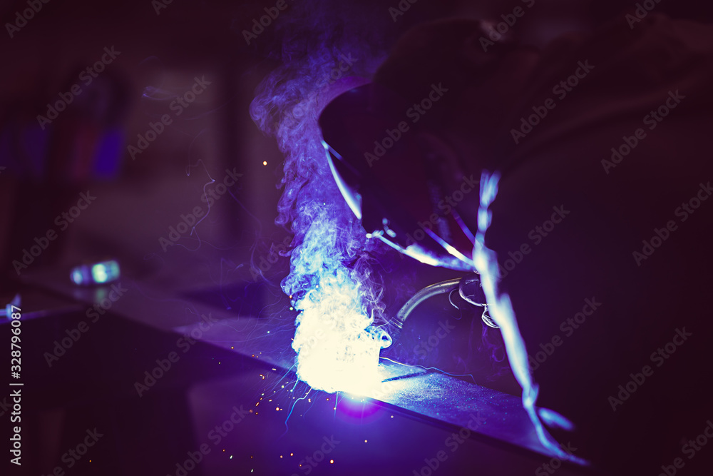 Fototapeta premium Professional welder with protection mask