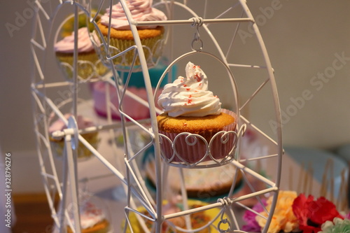 Cupcake stand. Homemade dessert party, colorful sugar dots. Vanilla tasty