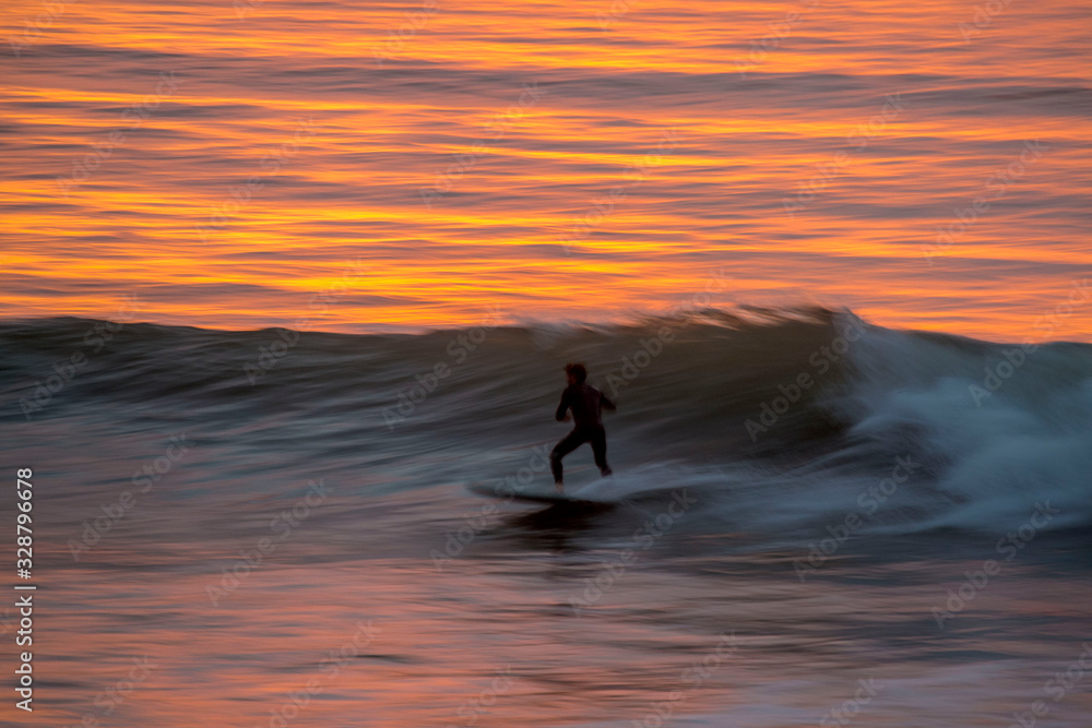Sunset surfing speed blur in california.