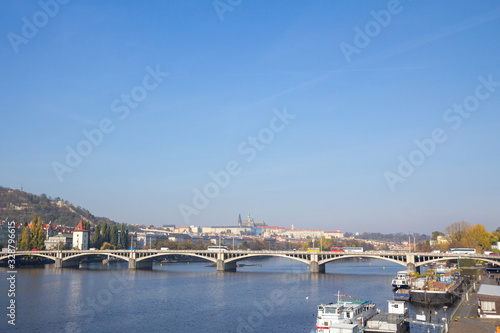 Panorama of the Old Town of Prague  Czech Republic  with a focus on Jiraskuv Most bridge and the Prague Castle  Hrad Praha  seen from the Vltava river. The castle is a touristic landmark of the city