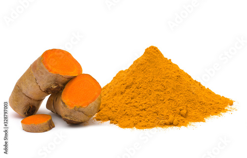 Turmeric (curcumin) rhizomes and powder isolated on a white background,Used for cooking and as herbal medicine,copy space.