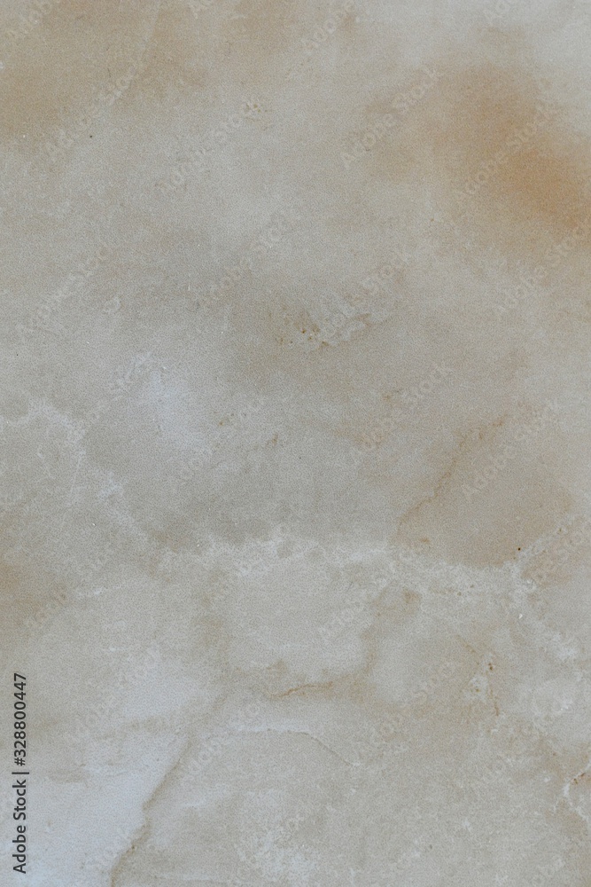 Fototapeta premium Natural beige polished marble with a slick island in the center.