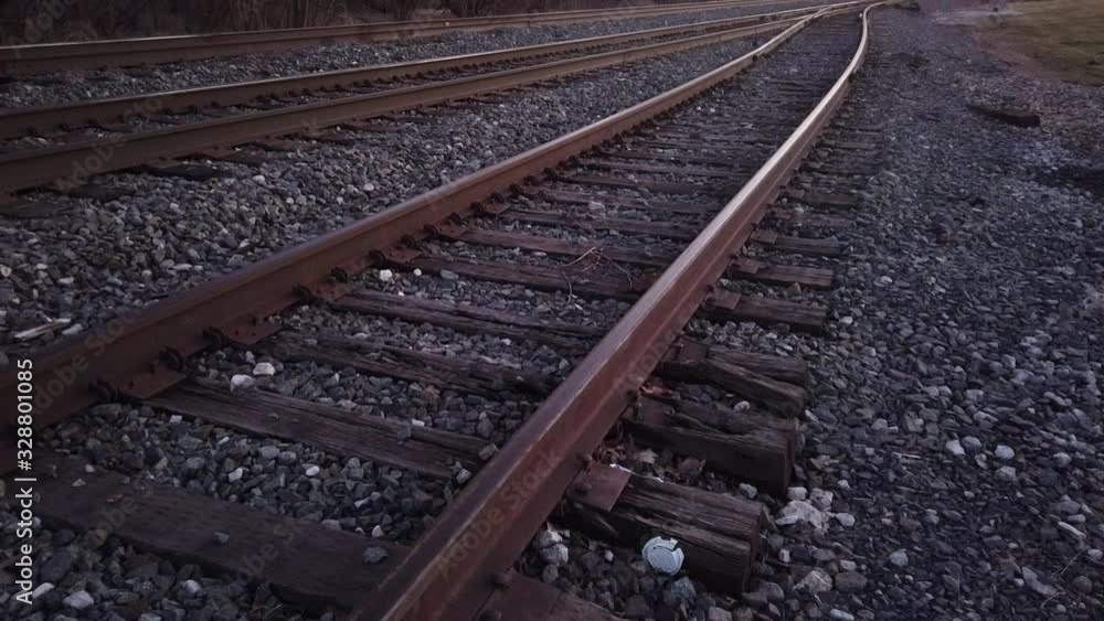 Camera Pans down the railroad tracks - slow motion Camera Pans down the railroad tracks - slow motion