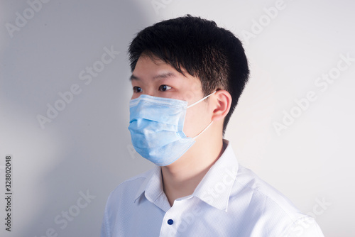 A man wearing a disposable medical surgical mask