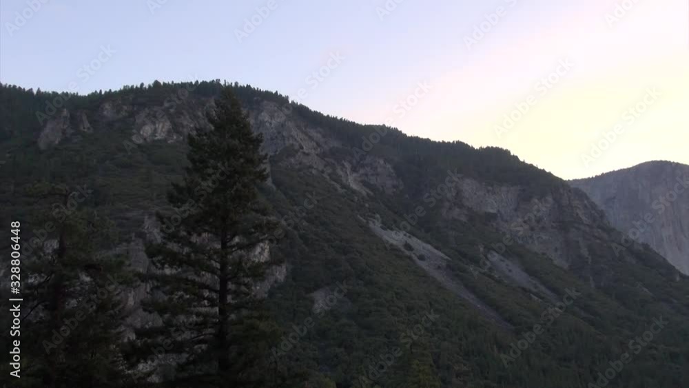 Left to right pan over hill sees red sun in the end. Left to right pan over hill sees red sun in the end.