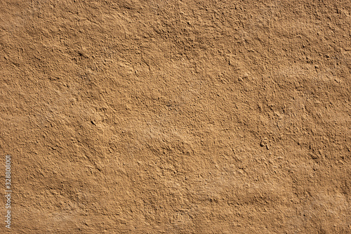 Soil wall texture of clay house structure, wall home made from mud with vintage tone picture. Soft picture