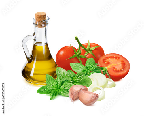 Italian pesto ingredients, tomato, green basil, garlic, onion and olive oil in bottle isolated on white background