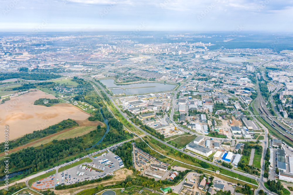 aerial panoramic image of city suburbs. industrial area with industrial buildings, plants, warehouses