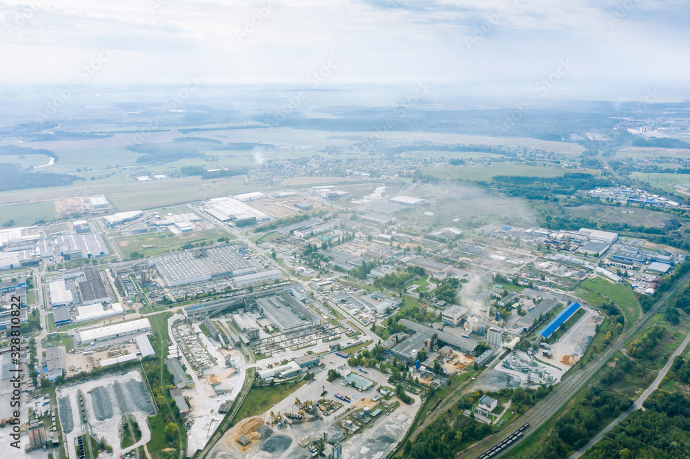 aerial panoramic view of industrial area landscape. blue sky background with clouds. city suburbs