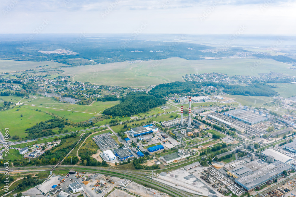 panoramic image of city industrial area. manufacturing companies, factories and warehouses in city suburbs