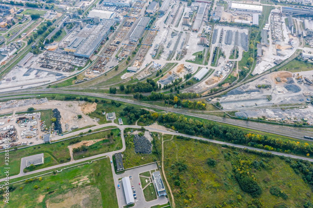 aerial top down view on city industrial zone with lots of plants, factories and warehouses