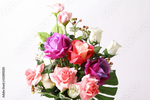 Colorful flower arrangement centerpiece in white ceramic vase © Suwit