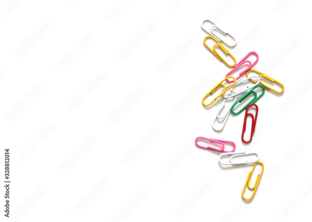 Obraz premium Colored paper clips on white background