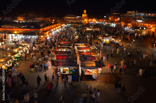 Overview of food vendors and shops at night in Place Djemaa el Fna square Marrakech Morocco © Reimar
