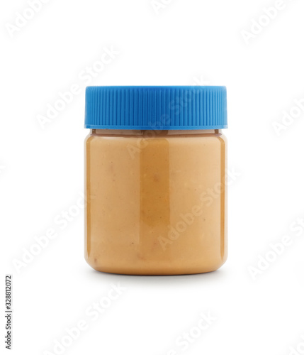 Coarse peanut butter in clear plastic Packaging With a blue lid isolated on white background, clipping path.