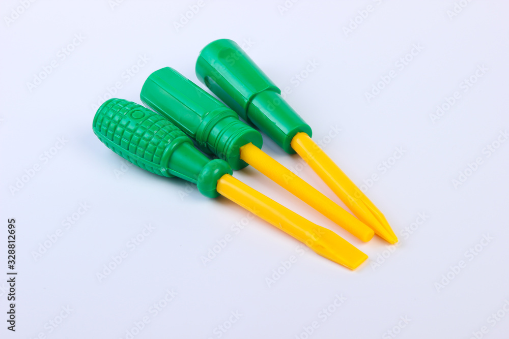 Set of plastic toy screwdrivers on a white background Set of plastic toy screwdrivers on a white background
