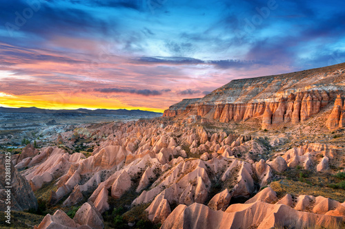 Beautiful mountains and Red valley at sunset in Goreme, Cappadocia in Turkey.