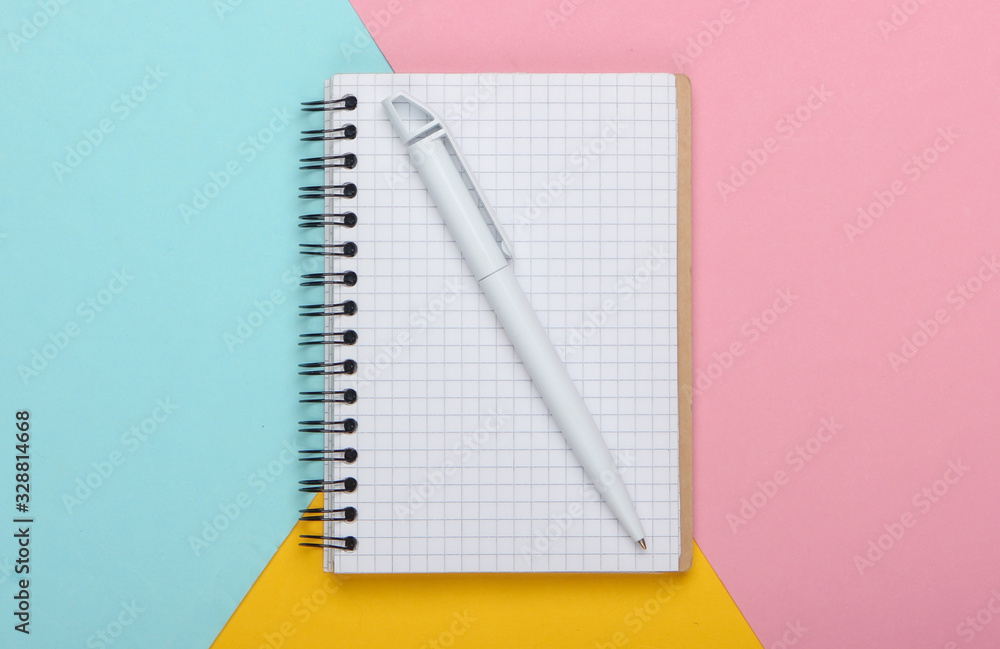 Notebook on pastel colored background. Top view Notebook on pastel colored background. Top view