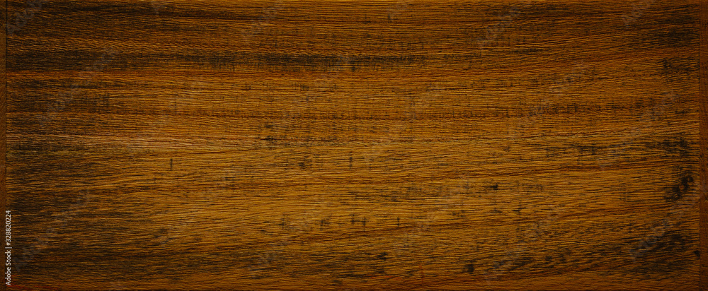 Naklejka premium Dark brown with remnants of black paint wooden background texture