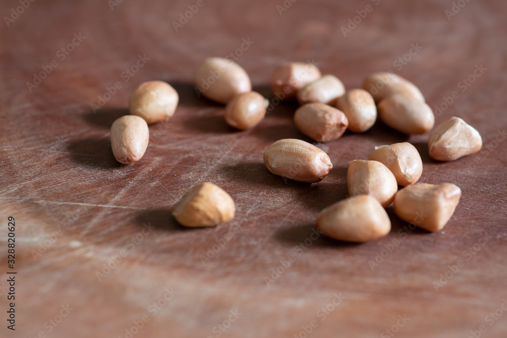 Raw Peanuts on wooden background Raw Peanuts on wooden background