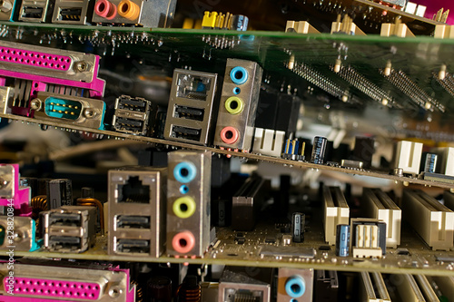 close up, old electronic motherboards from computers are lying in a pile