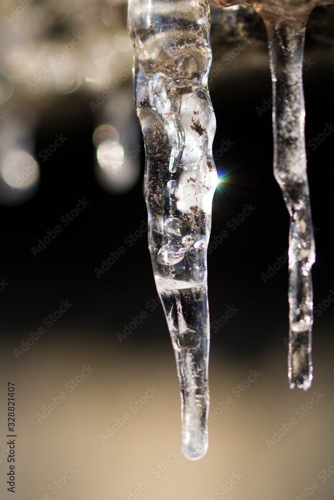 Spring background of bright transparent icicles close-up Spring background of bright transparent icicles close-up