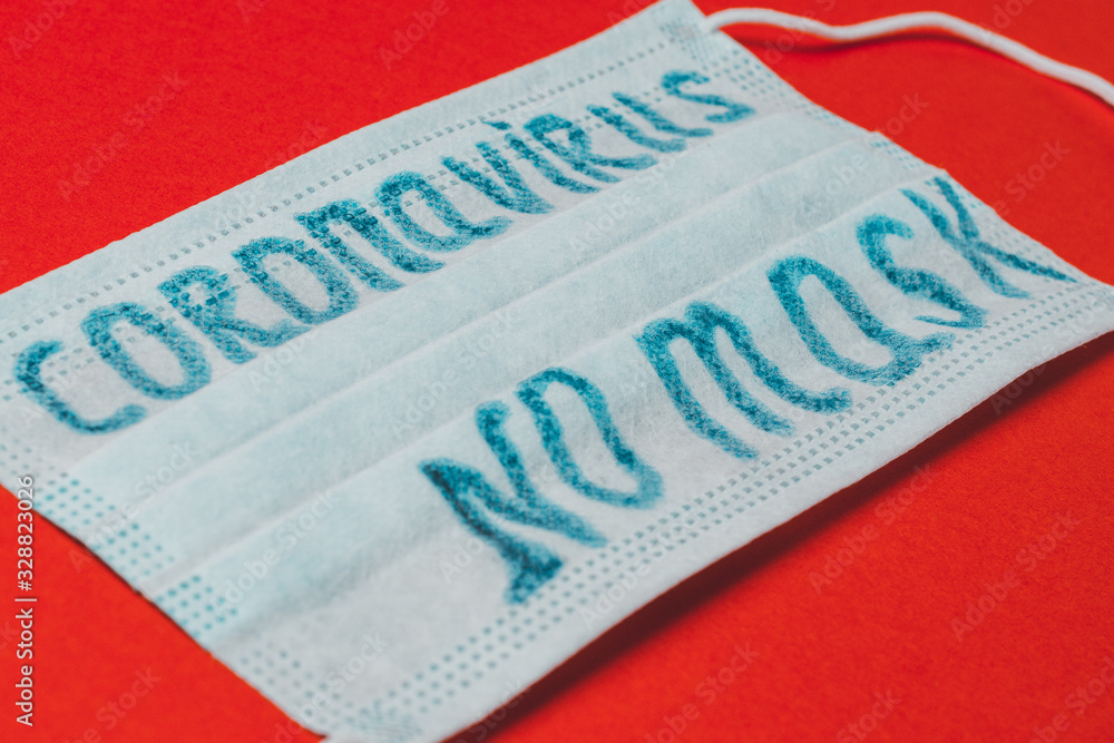 Obraz premium inscription coronavirus on mask, inscription no masks on red background.