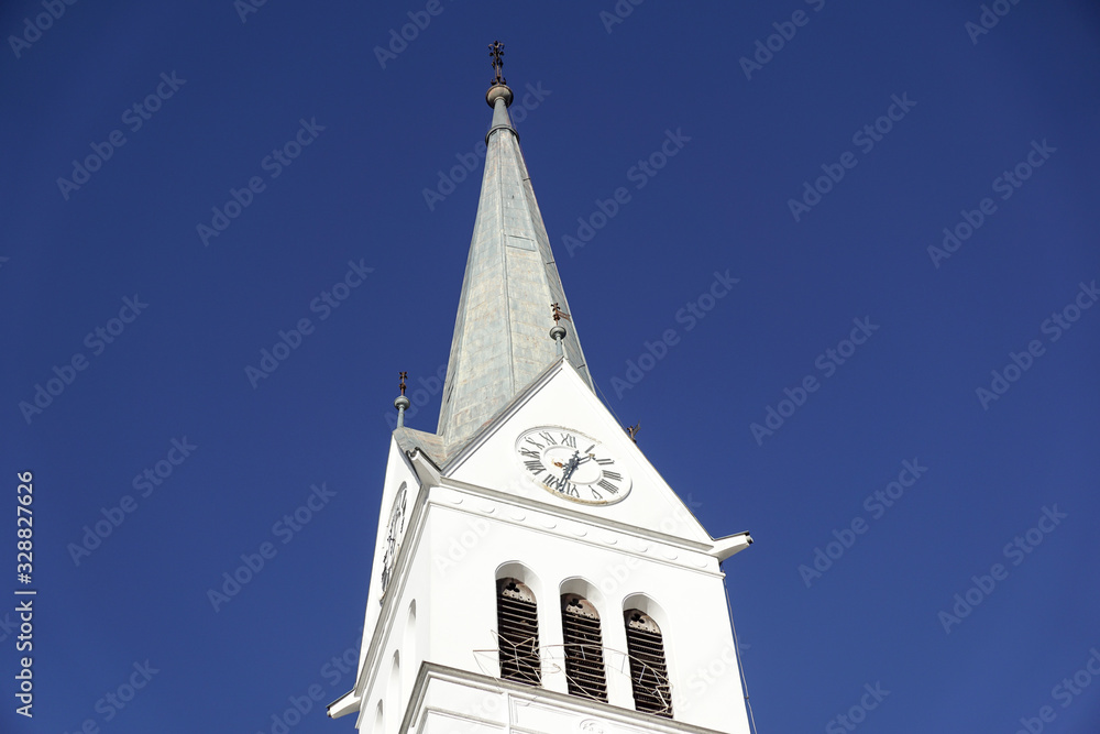 bell tower of a church with blue sky background