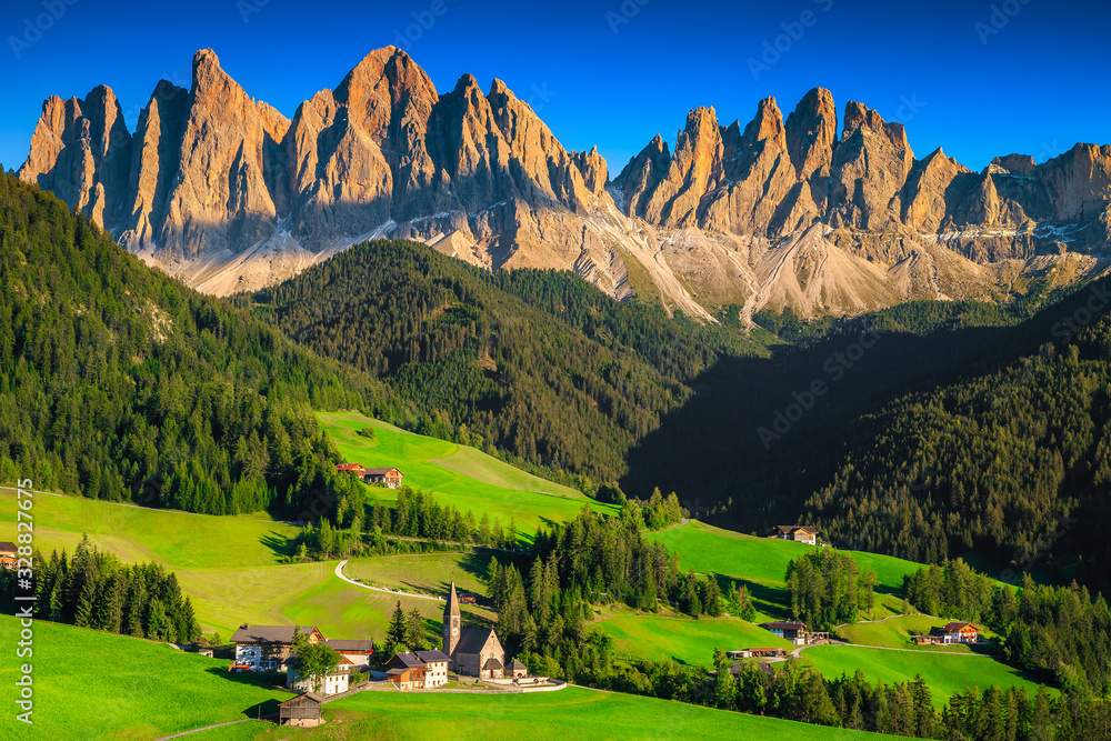 Amazing alpine landscape with green fields and mountains, Funes valley, Dolomites, Italy