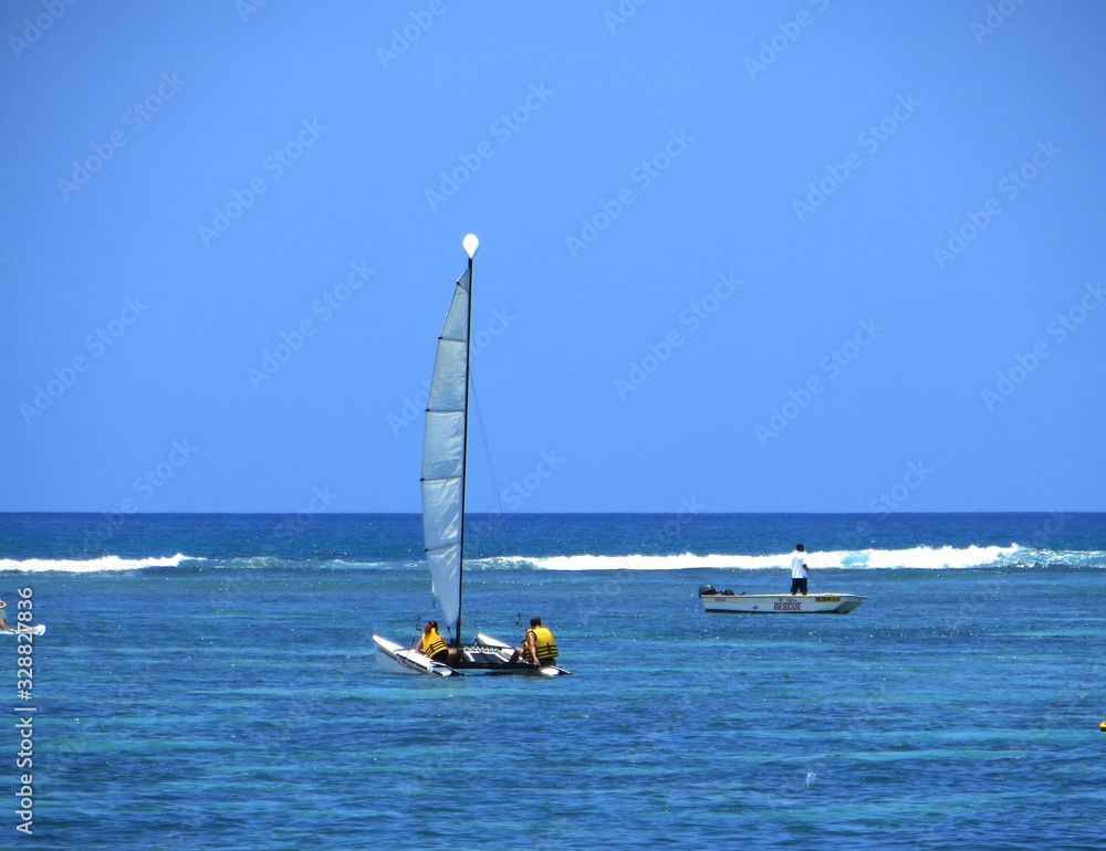 Obraz premium lonely sailing yachts in the Indian Ocean at the equator 