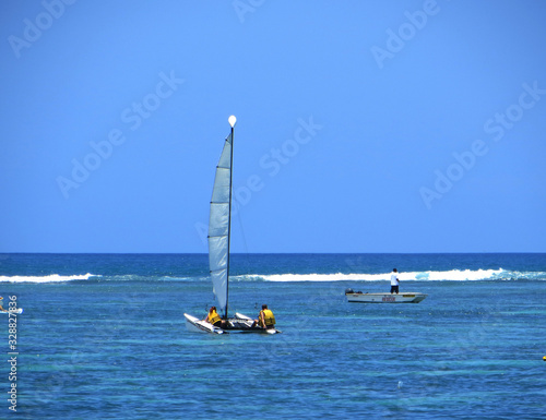 lonely sailing yachts in the Indian Ocean at the equator 