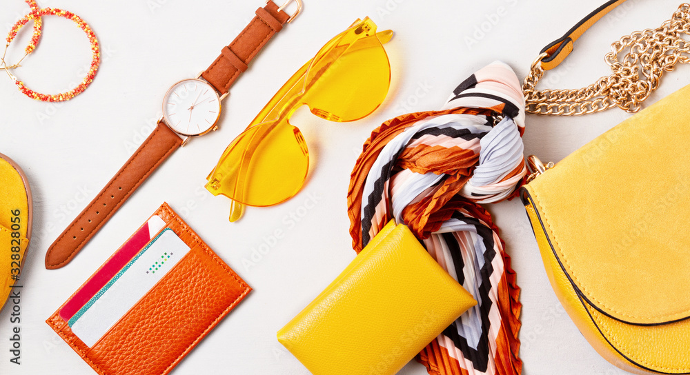 Flat lay with woman fashion accessories in yellow colors. Fashion, online beauty blog, summer style, shopping and trends idea