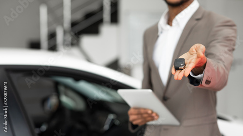 Seller Guy Offering Car Key Selling Auto In Dealership, Cropped