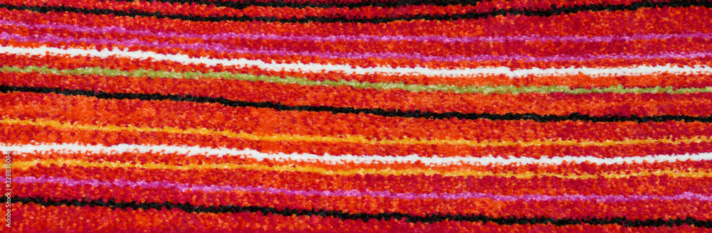 background of a chenille rug with horizontal stripes colored wit